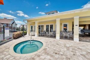 a home with a pool in the middle of a patio at New Awesome decorated dreamhouse in Orlando