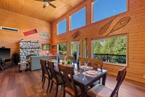 a dining room with a table and chairs and a fireplace at Enchantment Haus in Leavenworth