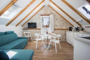 a living room with a couch and a table at Tragos Lemon Tree in Trogir