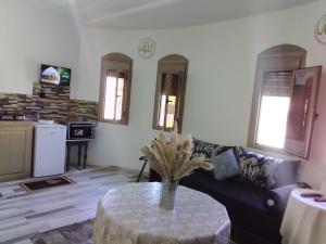 a living room with a couch and a table at Welcome Home in Beni Mellal
