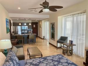 a living room with a couch and a table at Jaco Oceanfront Condo #1119 in a Luxury Resort in Jacó