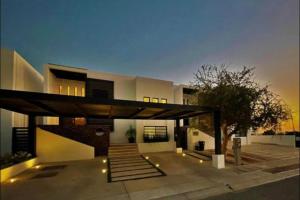 a modern house with a roof with lights on it at Apartamento en Cabo San Lucas México in Cabo San Lucas