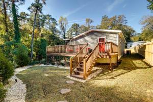 a home with a deck and a house at Step-Free Home with Fire Pit - 3 Miles to USC! in Columbia