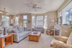 a living room with a couch and a fireplace at Seaside Vacation Rental in Seaside