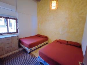 Postel nebo postele na pokoji v ubytování Kasakai Beachouse
