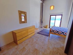 Postel nebo postele na pokoji v ubytování Kasakai Beachouse