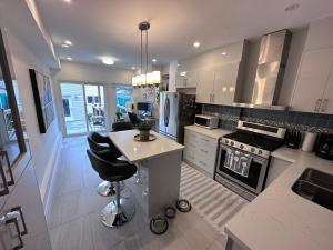 a kitchen with a island in the middle of it at Toronto GREAT Located in Toronto