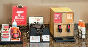 a counter top with a sewing machine and a box at Hampton Inn Nashua in Nashua