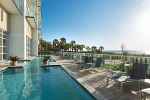 a swimming pool on the balcony of a hotel at Hilton Grand Vacations Club Ocean 22 Myrtle Beach in Myrtle Beach