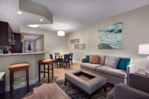 a living room with a couch and a table at Hilton Grand Vacations Club Ocean 22 Myrtle Beach in Myrtle Beach