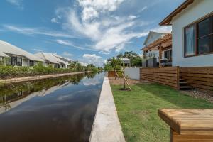 a canal in a home with houses at Conch Shell Cottage and The PoolClub at Mahogany Bay! in San Pedro