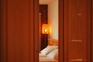 Postelja oz. postelje v sobi nastanitve Apartment with balcony and Panoramic Views of Alps