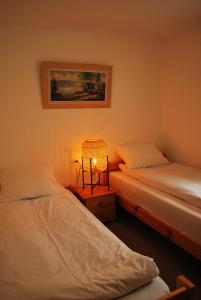 Postelja oz. postelje v sobi nastanitve Apartment with balcony and Panoramic Views of Alps