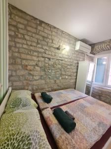 Voodi või voodid majutusasutuse Rooms & Studio Apartments Šibenik toas