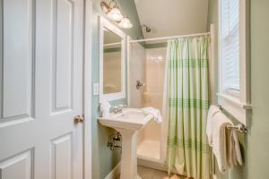 a bathroom with a sink and a shower at Mertini in Depoe Bay +34 photos