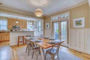 a kitchen and dining room with a table and chairs at Barnacle Bay in Lincoln City