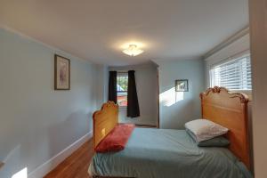 a bedroom with a bed and a window at Oceanfront Milbridge Getaway with Deck and Views! in Milbridge