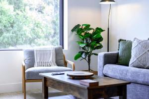 a living room with a couch and a coffee table at Revy's Stellar Retreat in Revelstoke