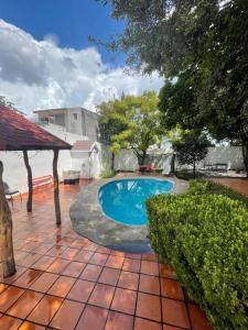 a small swimming pool in a yard with a patio at Beautiful Mountin Cabin/Pool/FirePit/Wifi/Parking in Monterrey