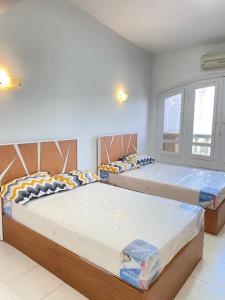 A bed or beds in a room at فيلا للايجار مارينا 5 الساحل الشمالي