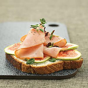 a sandwich with meat and vegetables on a plate at Stockholm Guest apartment 