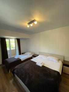 Postel nebo postele na pokoji v ubytování Motel & Restaurant Dar