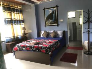 Ένα ή περισσότερα κρεβάτια σε δωμάτιο στο Hamadhi guest