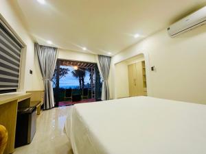 Ένα ή περισσότερα κρεβάτια σε δωμάτιο στο 24 Gold Homestay +68 φωτογραφίες