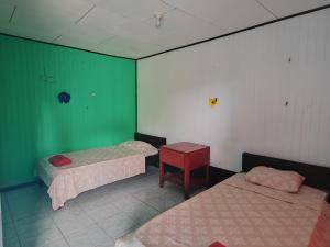 Postel nebo postele na pokoji v ubytování Hotel Gaviotas de Osa