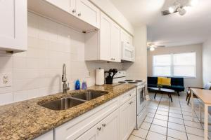 a kitchen with a sink and a counter top at Sunny Shores Retreat 2 in Clearwater Beach