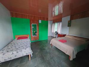 Postel nebo postele na pokoji v ubytování Hotel Gaviotas de Osa