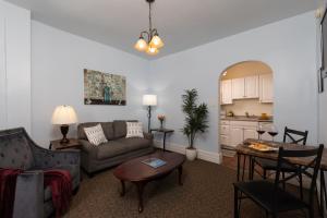 a living room with a couch and a table at Carlisle House Bed and Breakfast in Carlisle