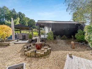 a backyard with a fire pit and a pavilion at The Summer House - Uk45102 in Hoel-galed