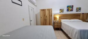 Postel nebo postele na pokoji v ubytování Apart Eco Estudio Joocah