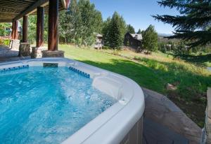 a large hot tub in a backyard with a yard at Bermuda Dr - Edwards in Edwards