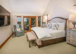 a bedroom with a large bed and a chair at Bermuda Dr - Edwards in Edwards