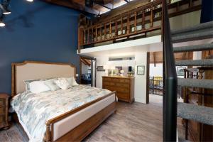 a bedroom with a bed and a loft at 846 County Rd 207 in Durango
