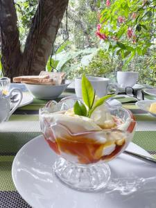 a table with a bowl of food on a plate at Ella Secret Paradise in Ella