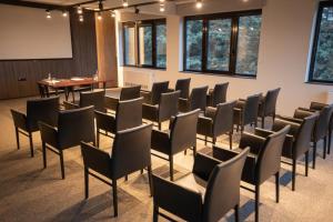 a room with chairs and a table in it at The Hunter's Lodge Kamnik in Skopje