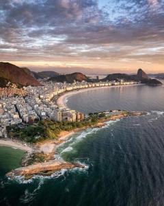 an aerial view of a beach with buildings and the ocean at Hostel Sapucali in Rio de Janeiro