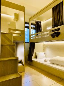 a room with two bunk beds and a mirror at Marina Homes in Dubai