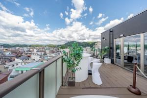 a balcony with toilets and a view of a city at Wat Hotel & Spa Hida Takayama in Takayama +76 photos