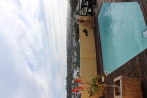 an overhead view of a swimming pool in a building at Royal Guest House in Port Alfred