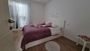 Postel nebo postele na pokoji v ubytování Apartment Pino