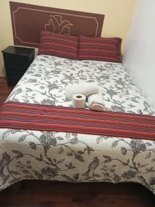 Cama ou camas em um quarto em Hospedaje Apu Salka