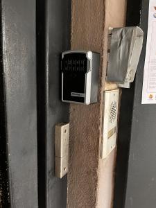 a metal door with a sign on it at NEW My Lodge - Parking, AC, Netflix & Wifi in Papeete +11 photos