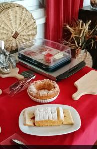 a table with a plate of cake and a pie at Agriturismo Le Vedute in Bisceglie