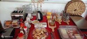 a table with food on a red counter top at Agriturismo Le Vedute in Bisceglie