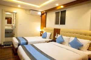 Кровать или кровати в номере Hotel Dreams Connect GRB 2