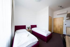 Postel nebo postele na pokoji v ubytování Mini Hotel Akord